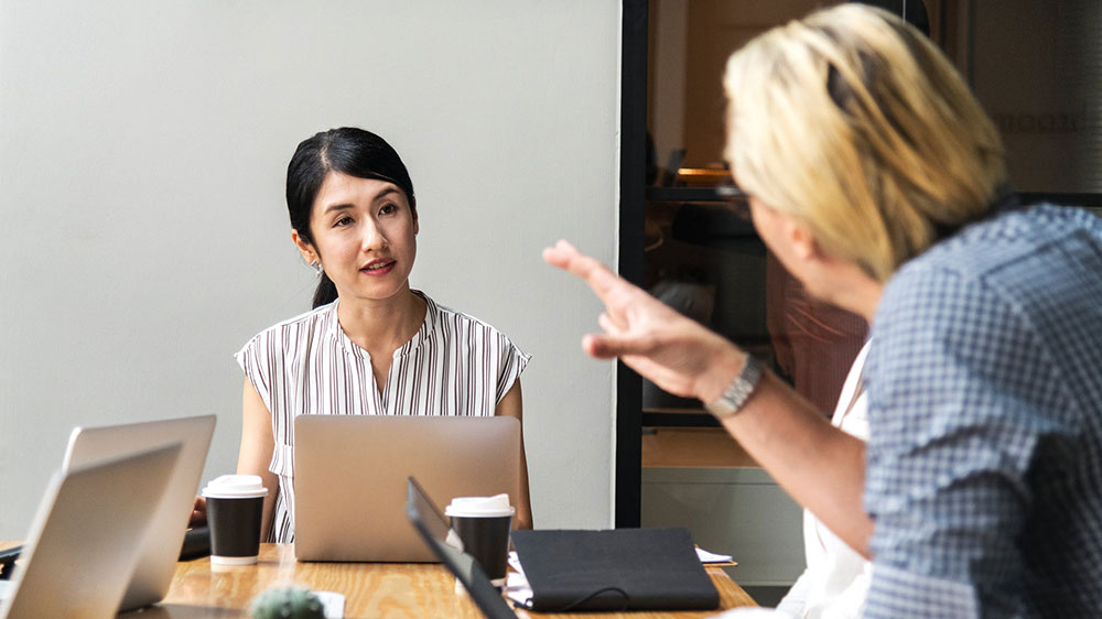 Woman Sitting Talking To Man