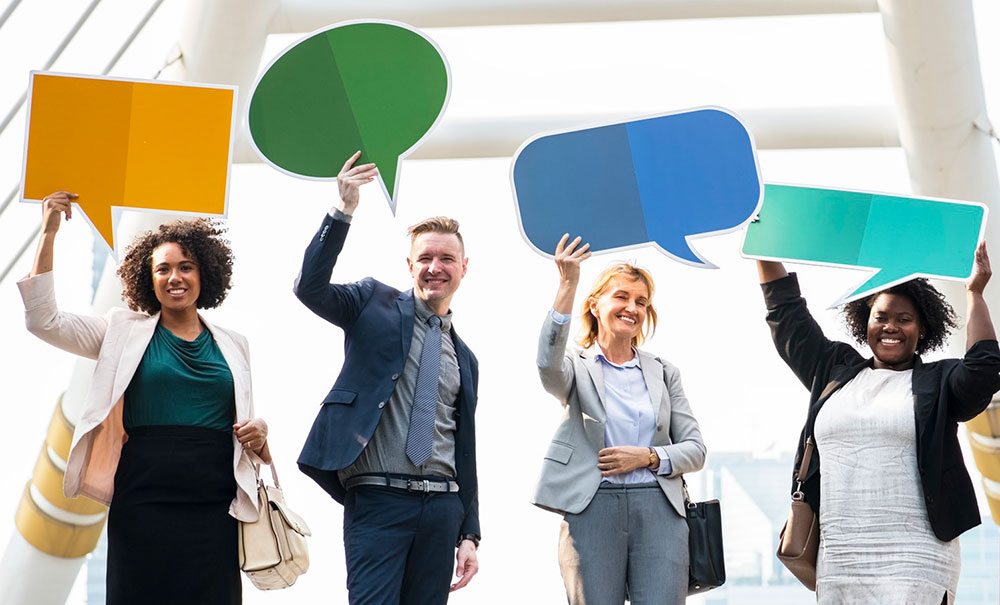 Business people holding up signs