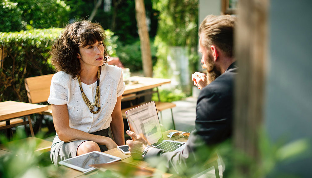 Man and Woman sitting outside talking