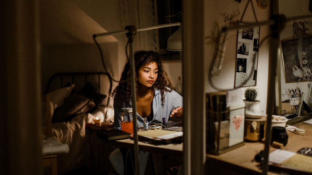 Female entrepreneur working late night at desk