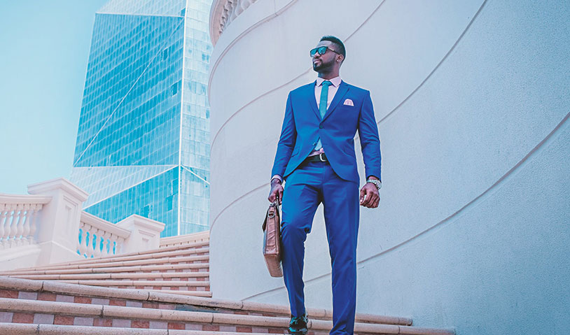 Selfish entrepreneur in blue suit walking down stair