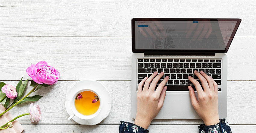 Blogging on white wooden table