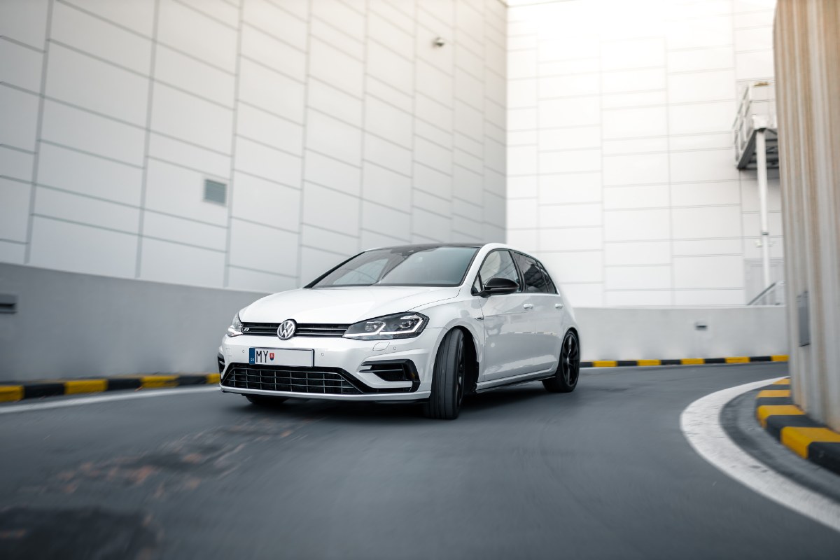 white hatchback on street