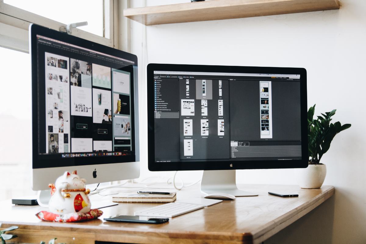 black and silver imacs on a table