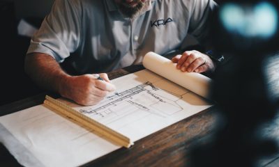 architect drawing a draft on paper
