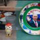two bejeweled bird figures and a plate showing vladimir putin
