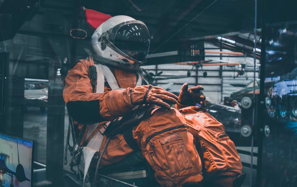astronaut in an orange suit