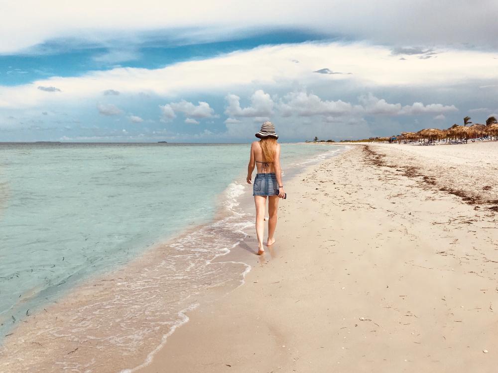 woman walking on sand