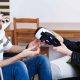 person handing another person a vr headset