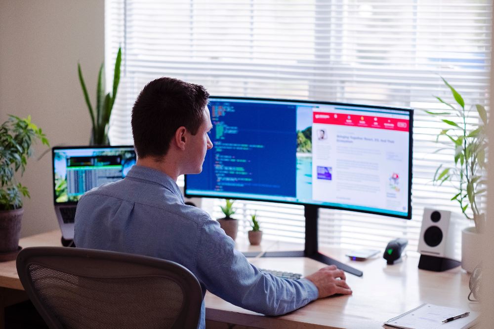 man working on his computer