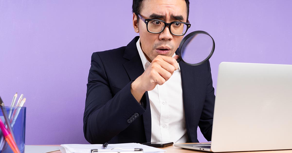 man using a magnifying glass