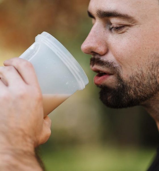 man drinking protein shake