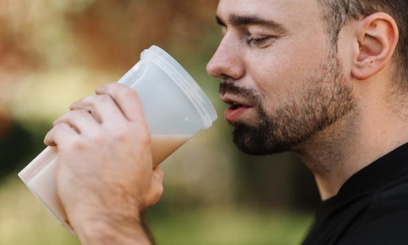 man drinking protein shake