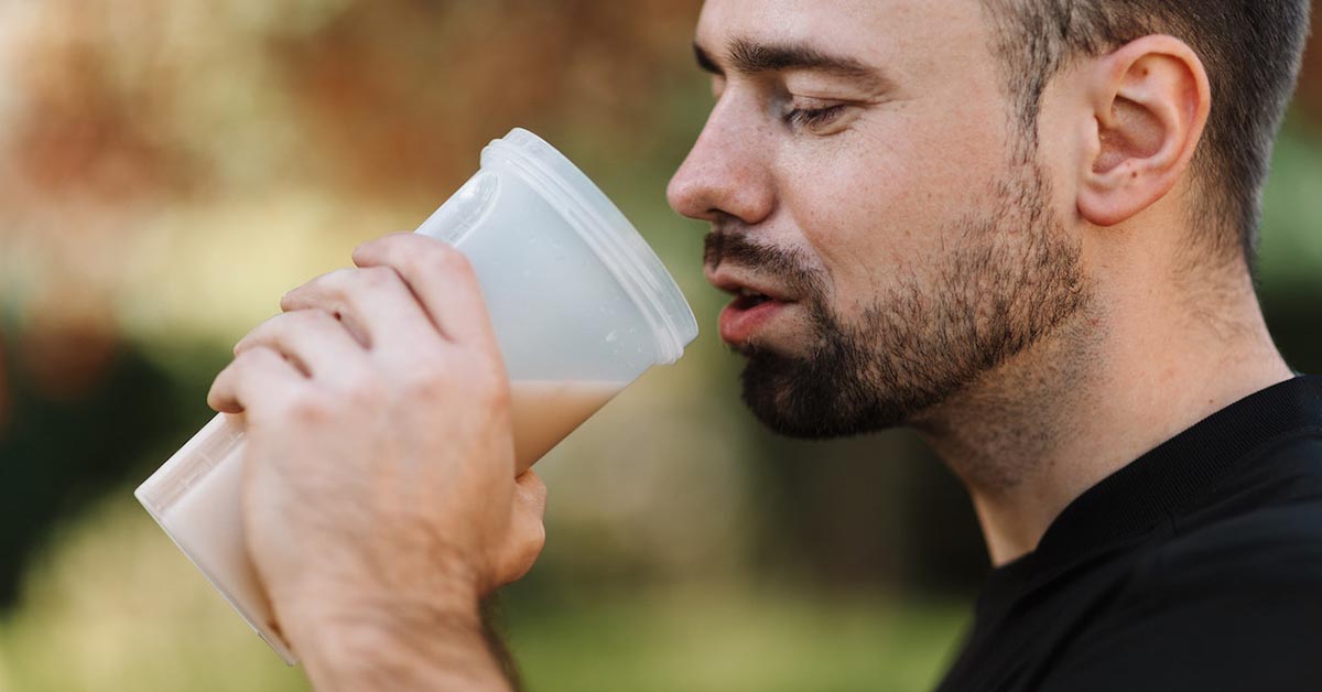 man drinking protein shake