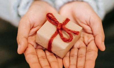 a woman's hands holding a gift