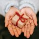 a woman's hands holding a gift