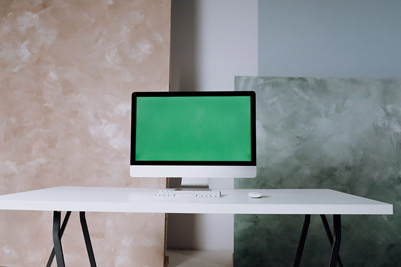 laptop with green background