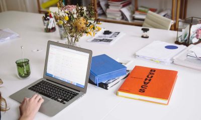 laptop and orange notebook