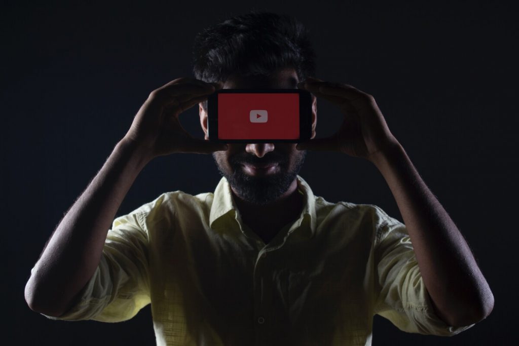 man wearing vr headset with a smartphone