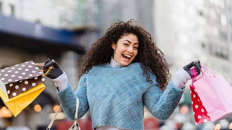 woman holding shopping bags