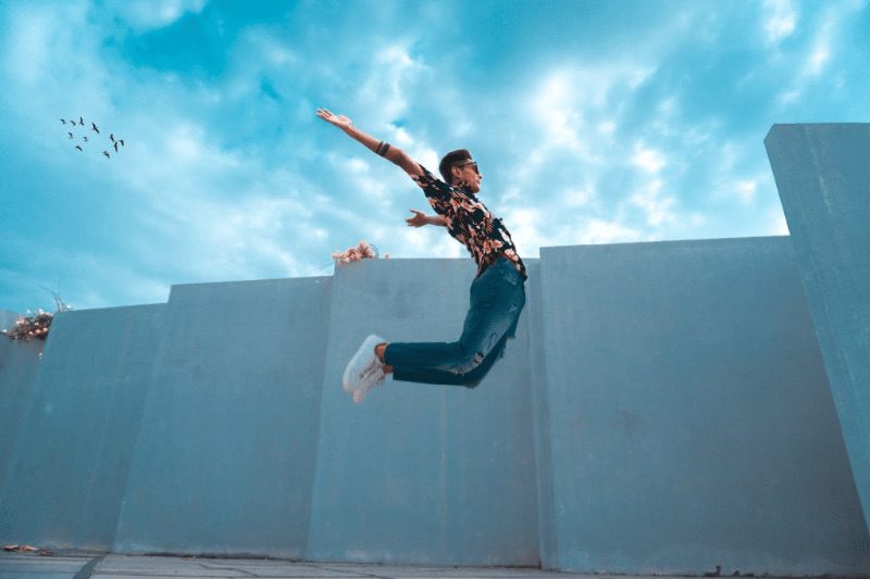 Flexible person jumping in the air