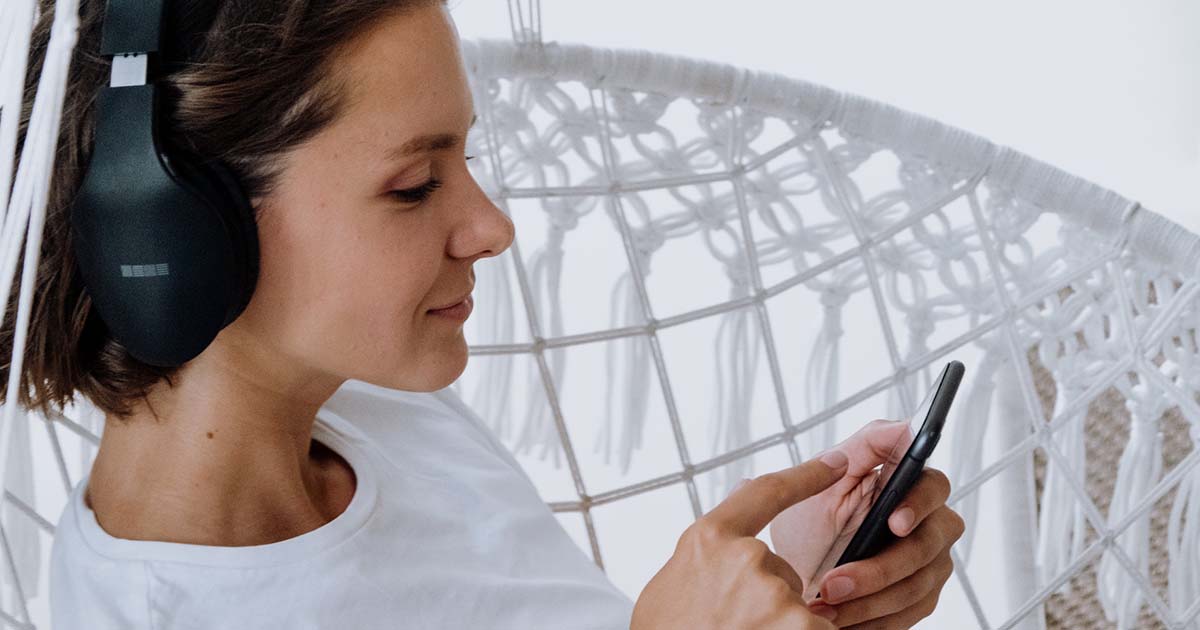 woman listening to music with headphones