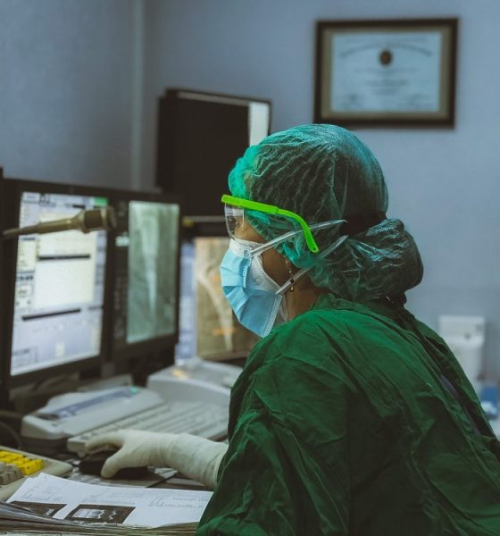 nurse typing on a computer