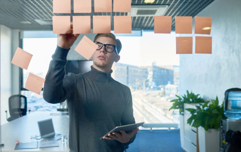 man using post-its