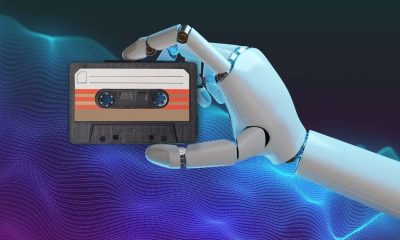 robot holding a cassette tape