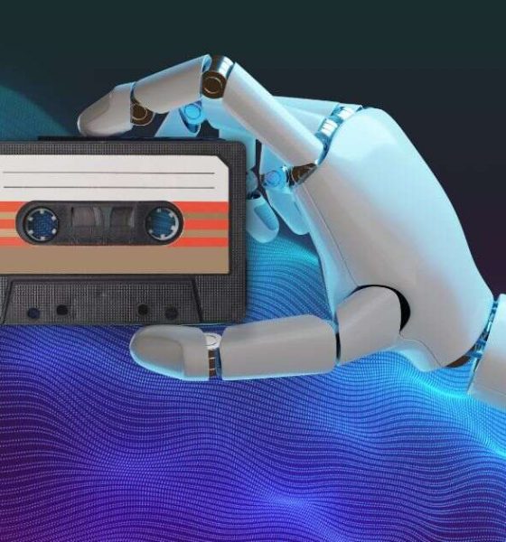 robot holding a cassette tape
