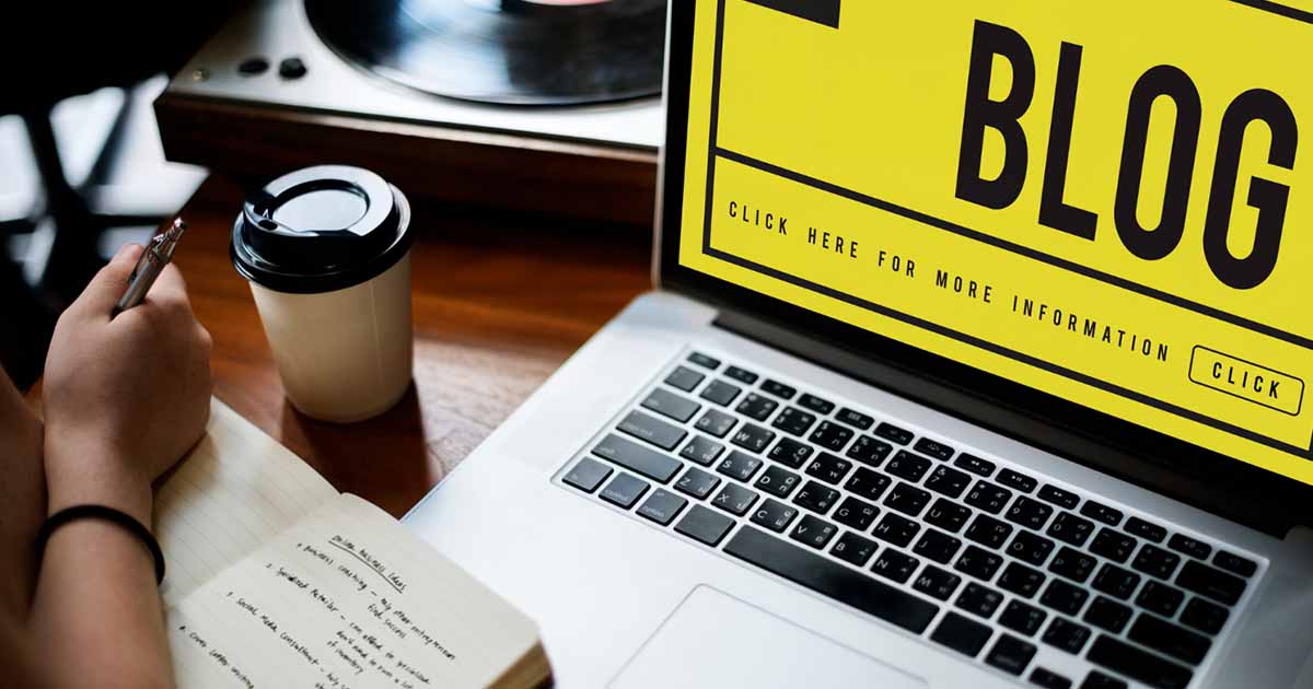 laptop with the word blog in yellow background