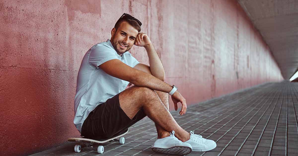 man sitting on a skateboard